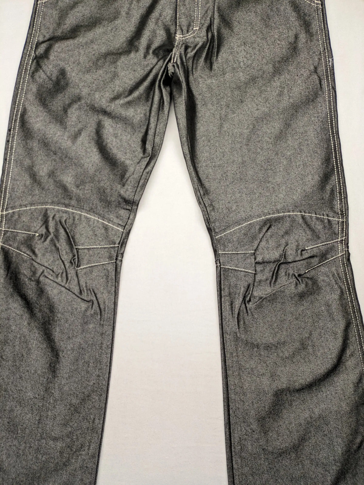 CIPO grey bootcut biker jeans with white contrast stitching and moto-inspired knee pleats.