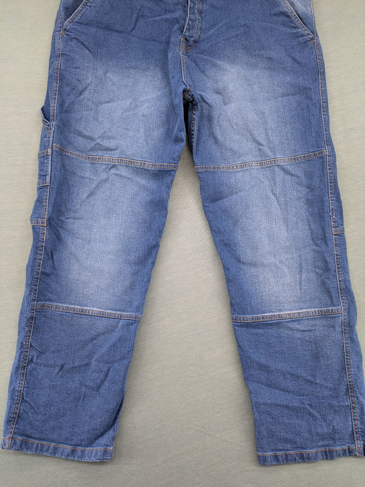 Bench blue straight jeans with reinforced knees and multiple cargo pockets.