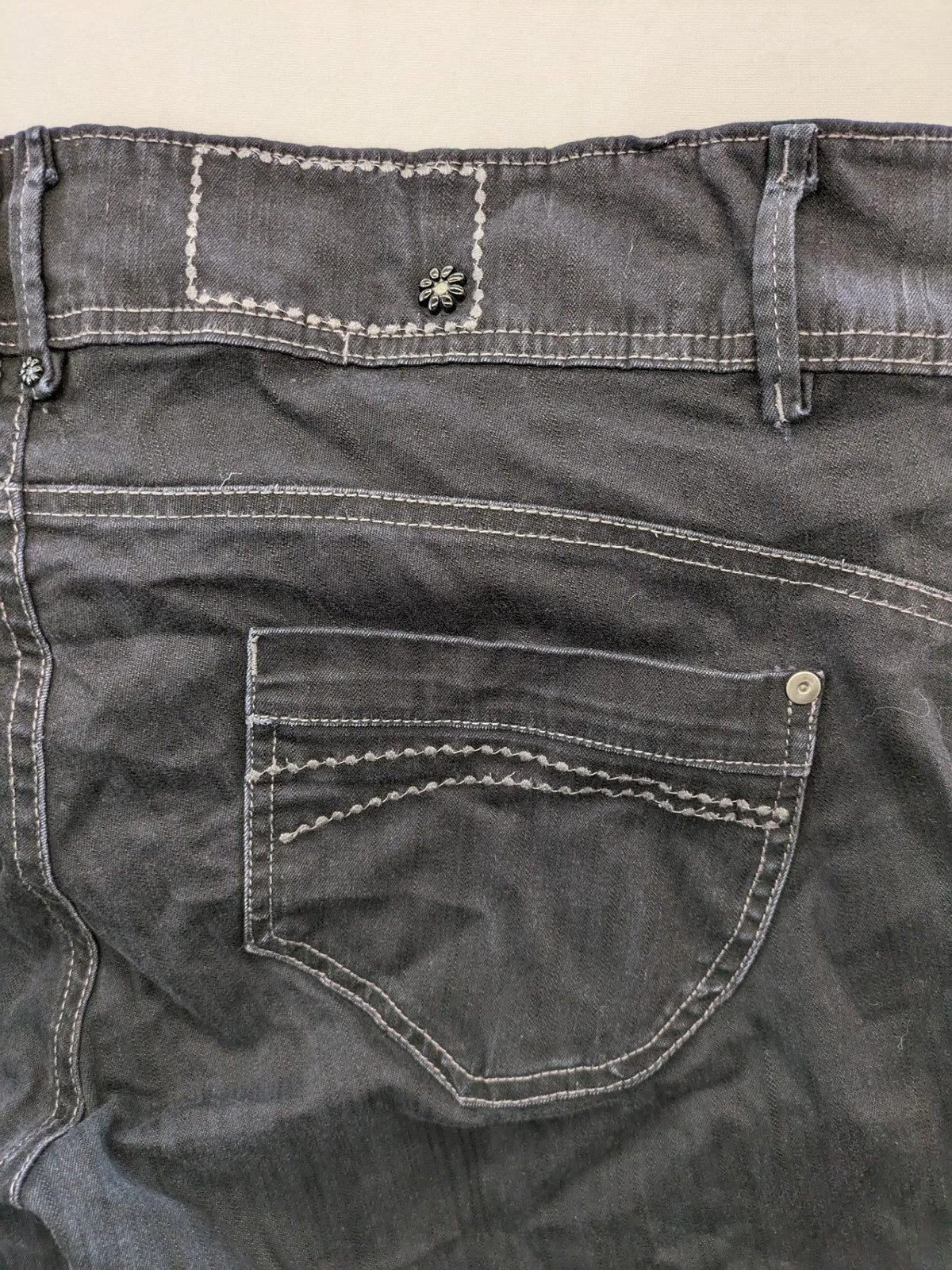 Okay grey straight jeans with contrast stitching and three-button closure, cotton stretch material.