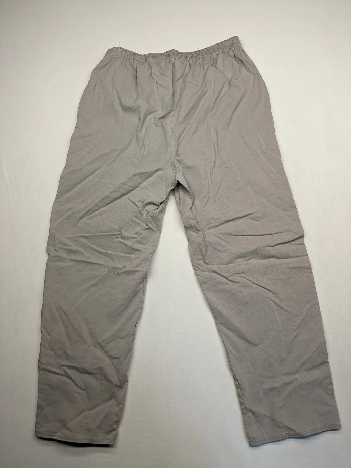 Cherry Berry khaki capri pants with elastic waistband and decorative buttons, featuring logo and zip pockets.