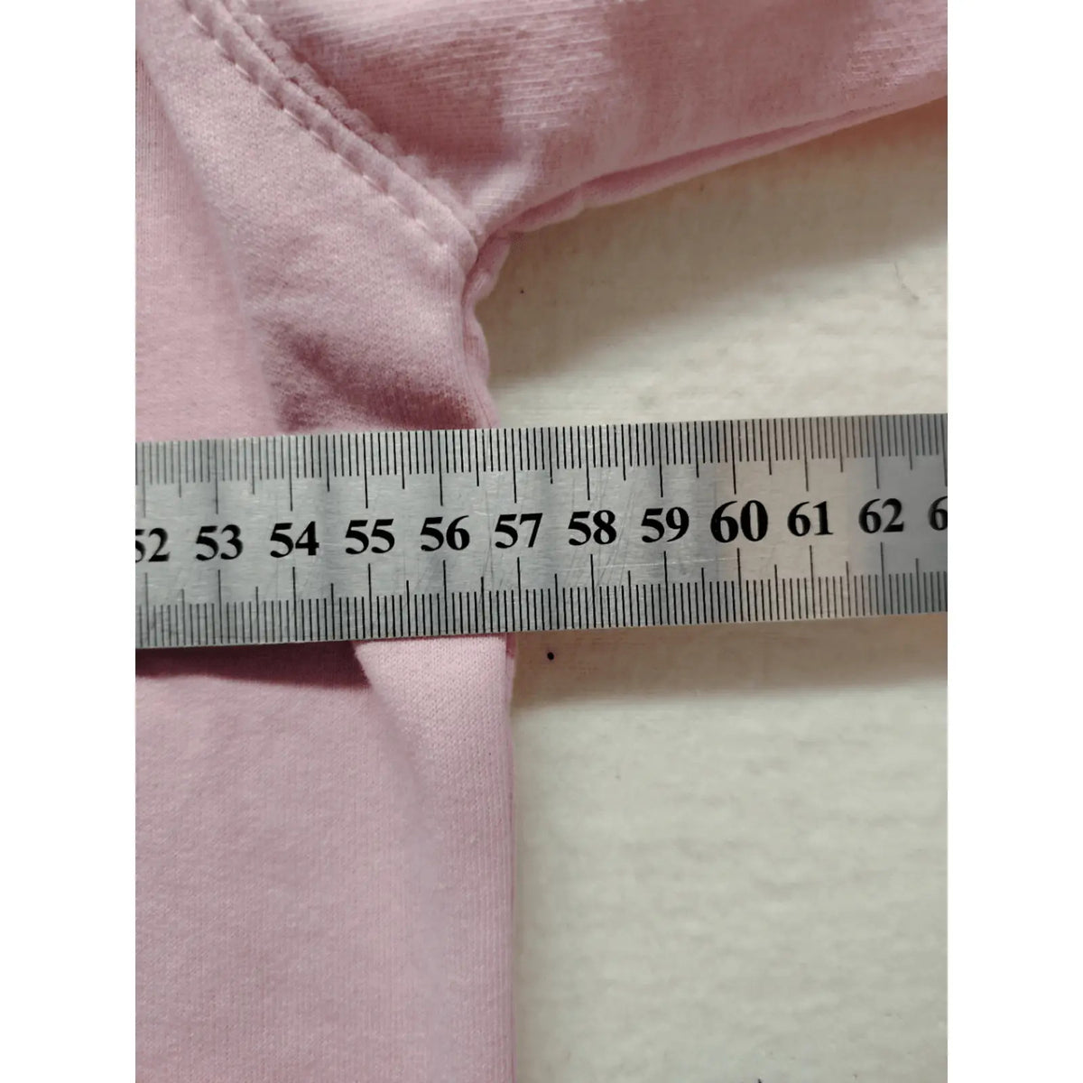 Just Hoods pink zip-through hoodie with "Trinkerbell" graphic, kangaroo pocket, drawstring hood.