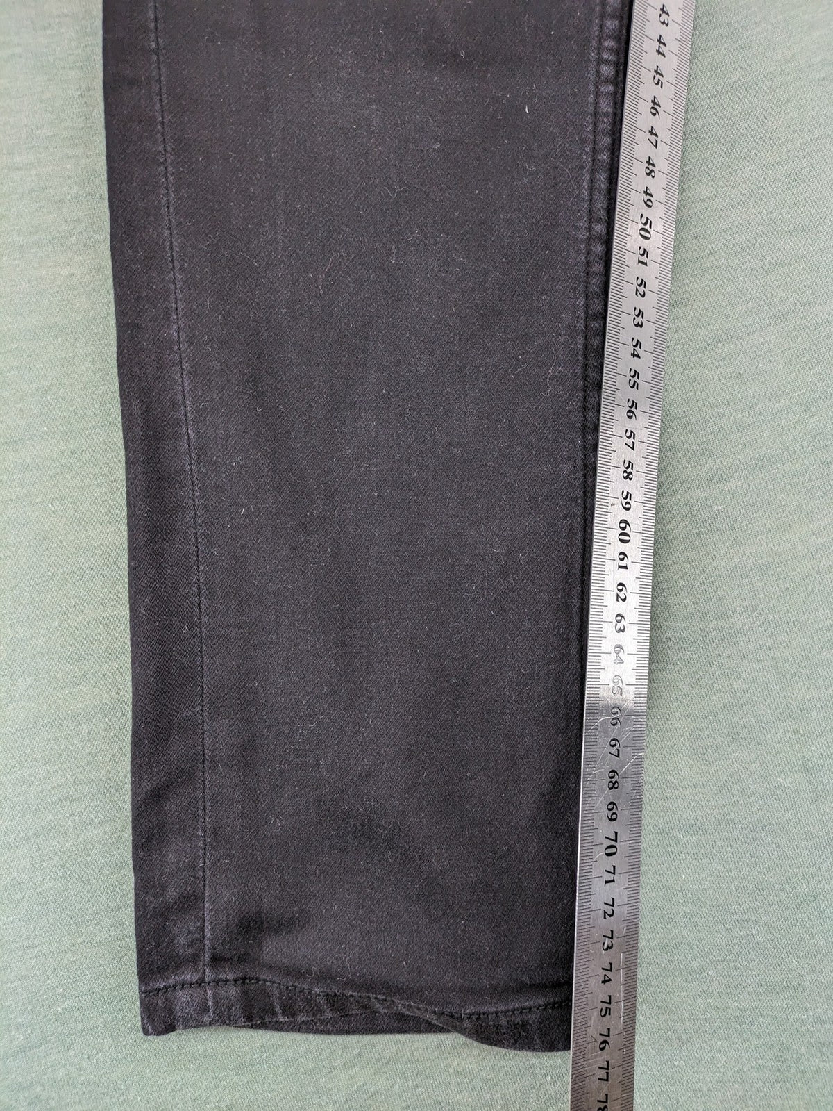 Savvy black straight jeans with washed finish and slim fit, made from stretch denim.