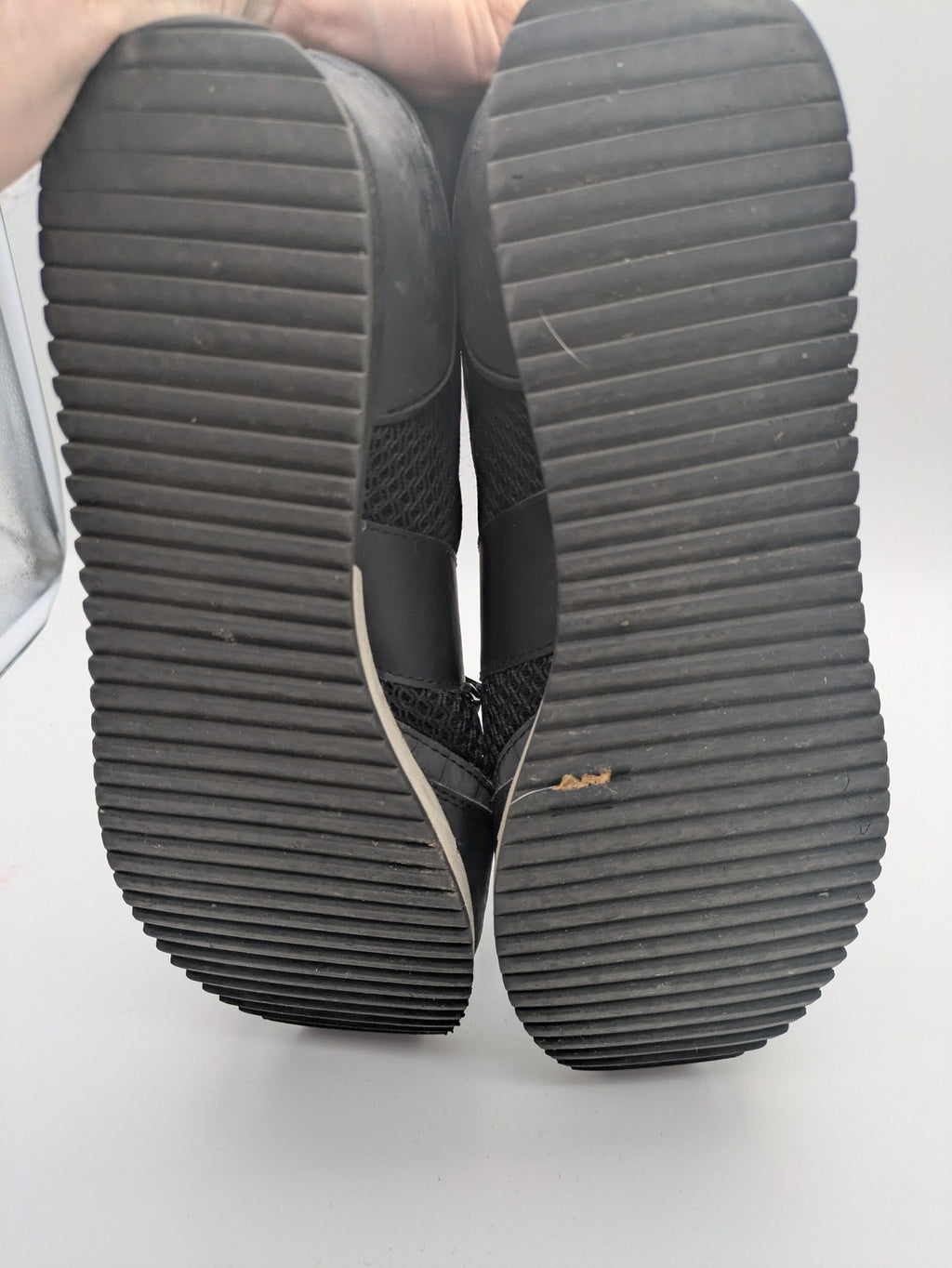 EA7 Emporio Armani beige and black sneakers with prominent EA7 branding and breathable mesh details.
