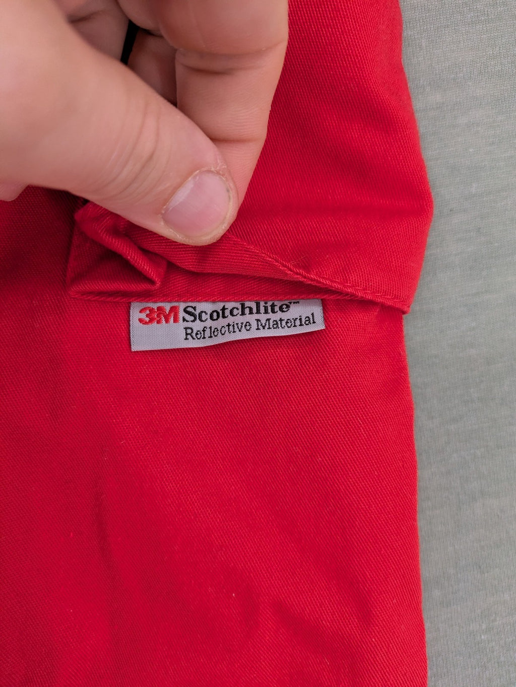 Bücking grey cargo work pants red accents with 3M Scotchlite reflective strips.