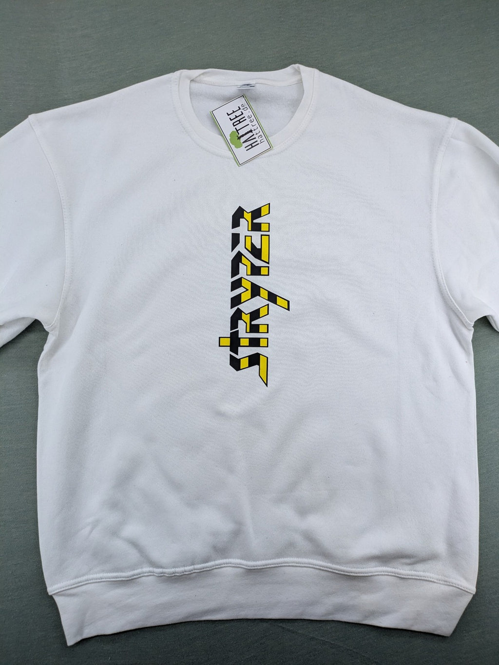 Stryper turtle neck jumper black with yellow vertical logo graphic on chest.