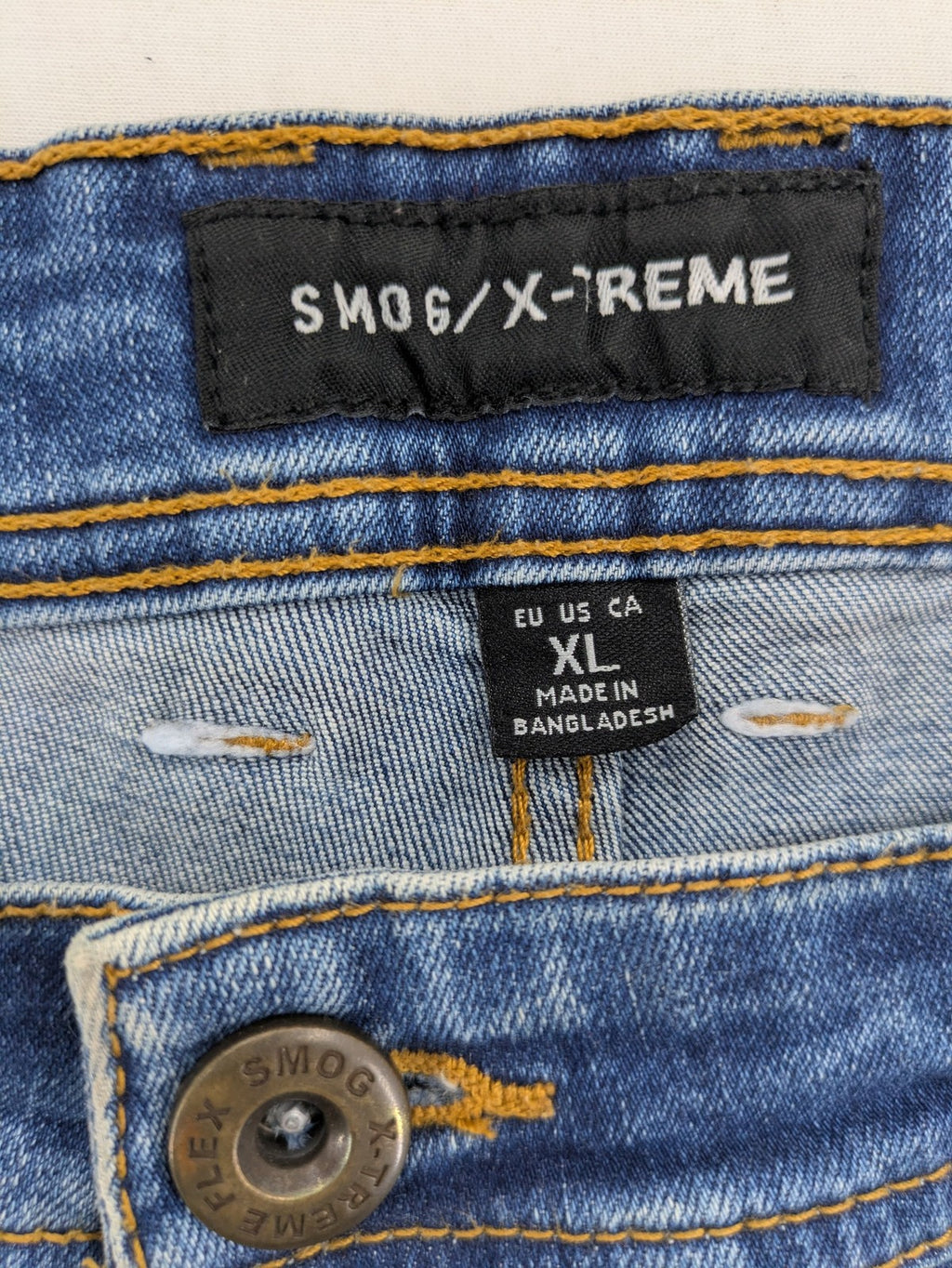 Smog blue denim shorts slim fit distressed details with rolled hem.
