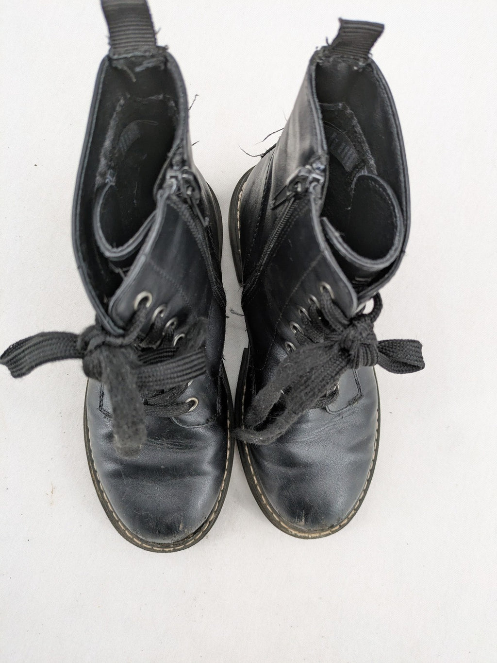Esprit black combat boots for girls with lace-up front and side zipper detail.