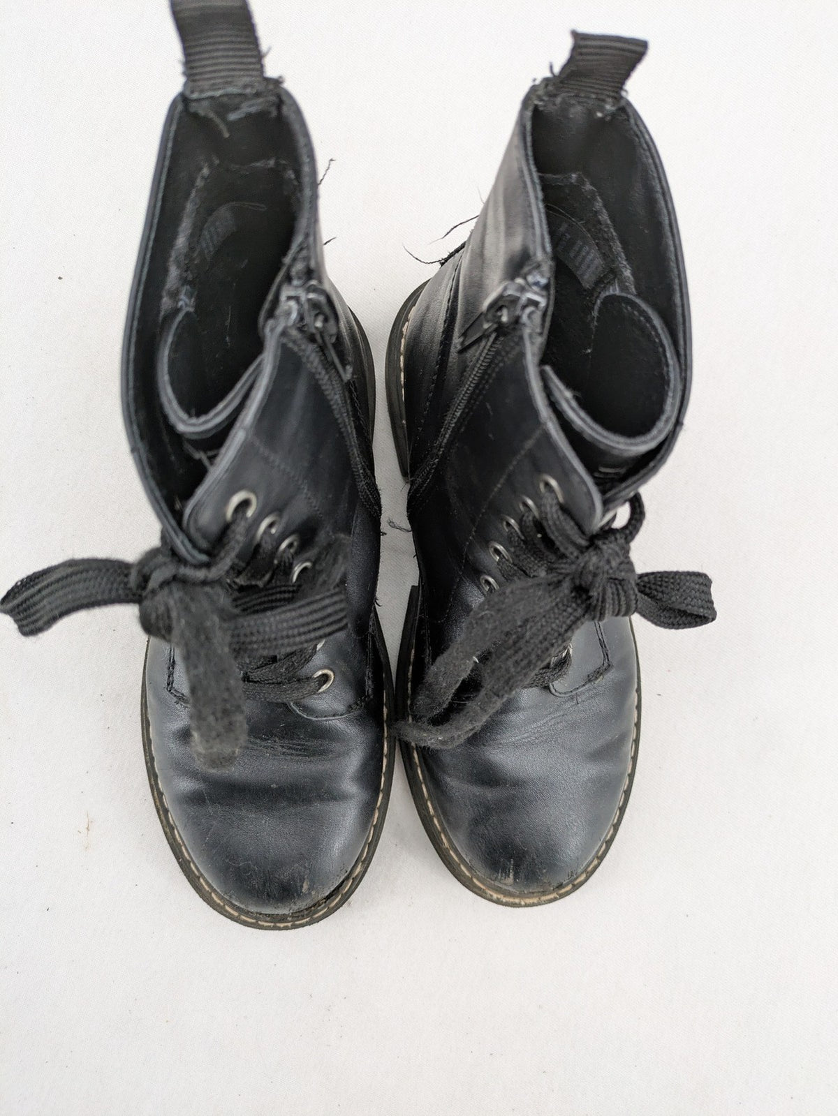 Esprit black combat boots for girls with lace-up front and side zipper detail.