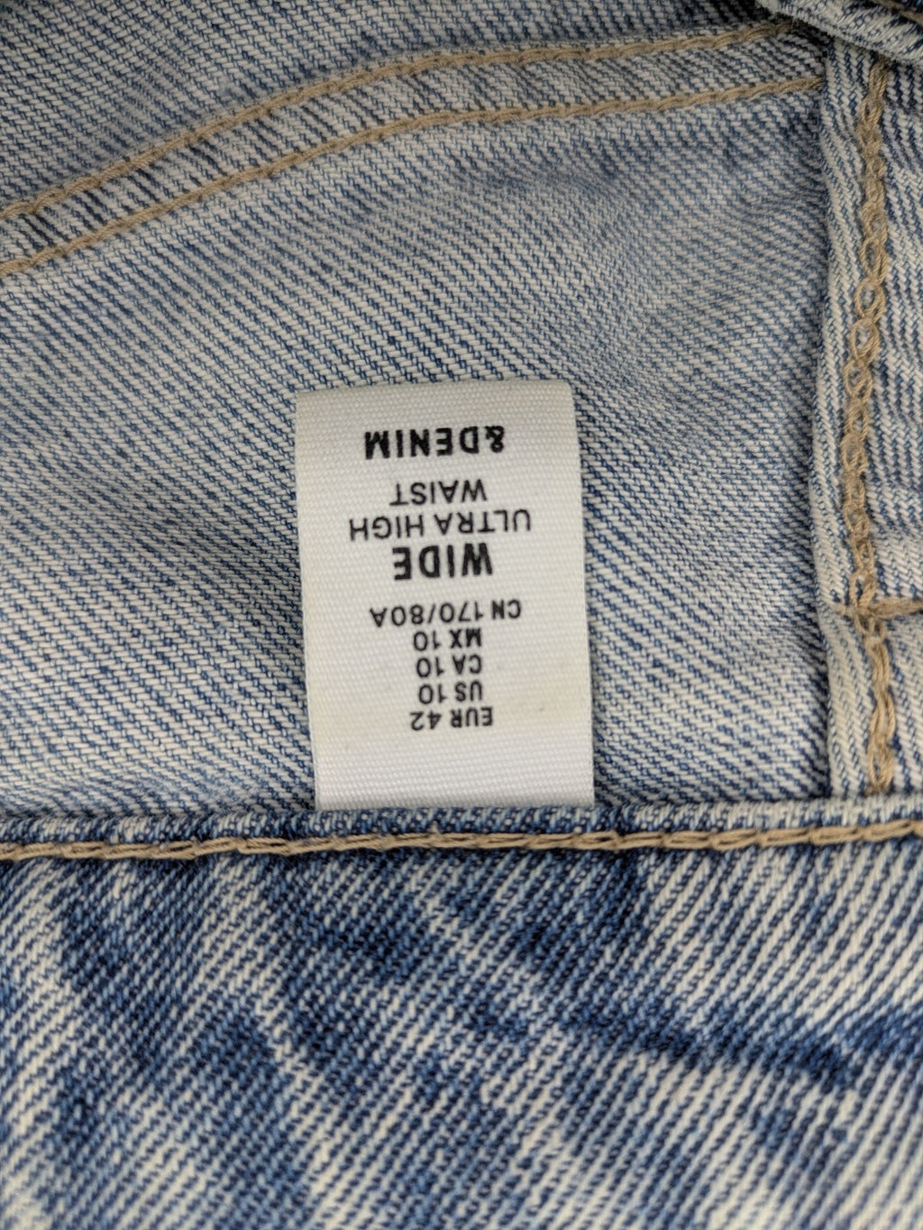 H&M blue wide leg jeans with distressed details and high waist, 100% cotton.