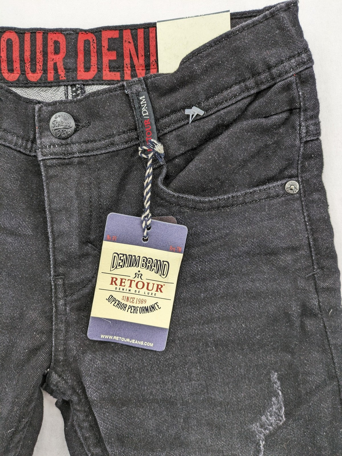 Skinny black straight jeans with distressed details and logo, made from durable denim.