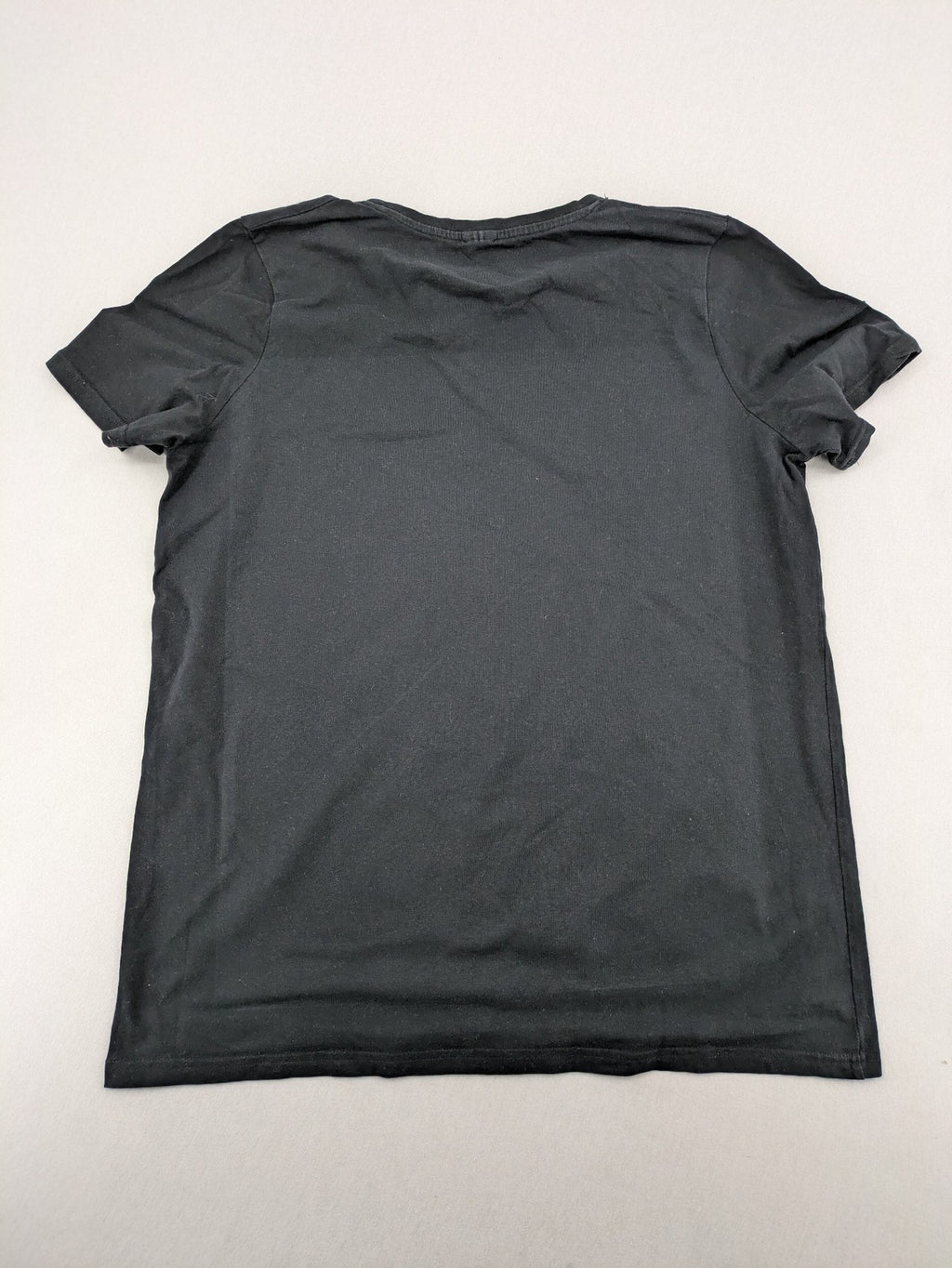 Dragon Ball Z black t-shirt featuring blue Son Goku silhouette graphic design.