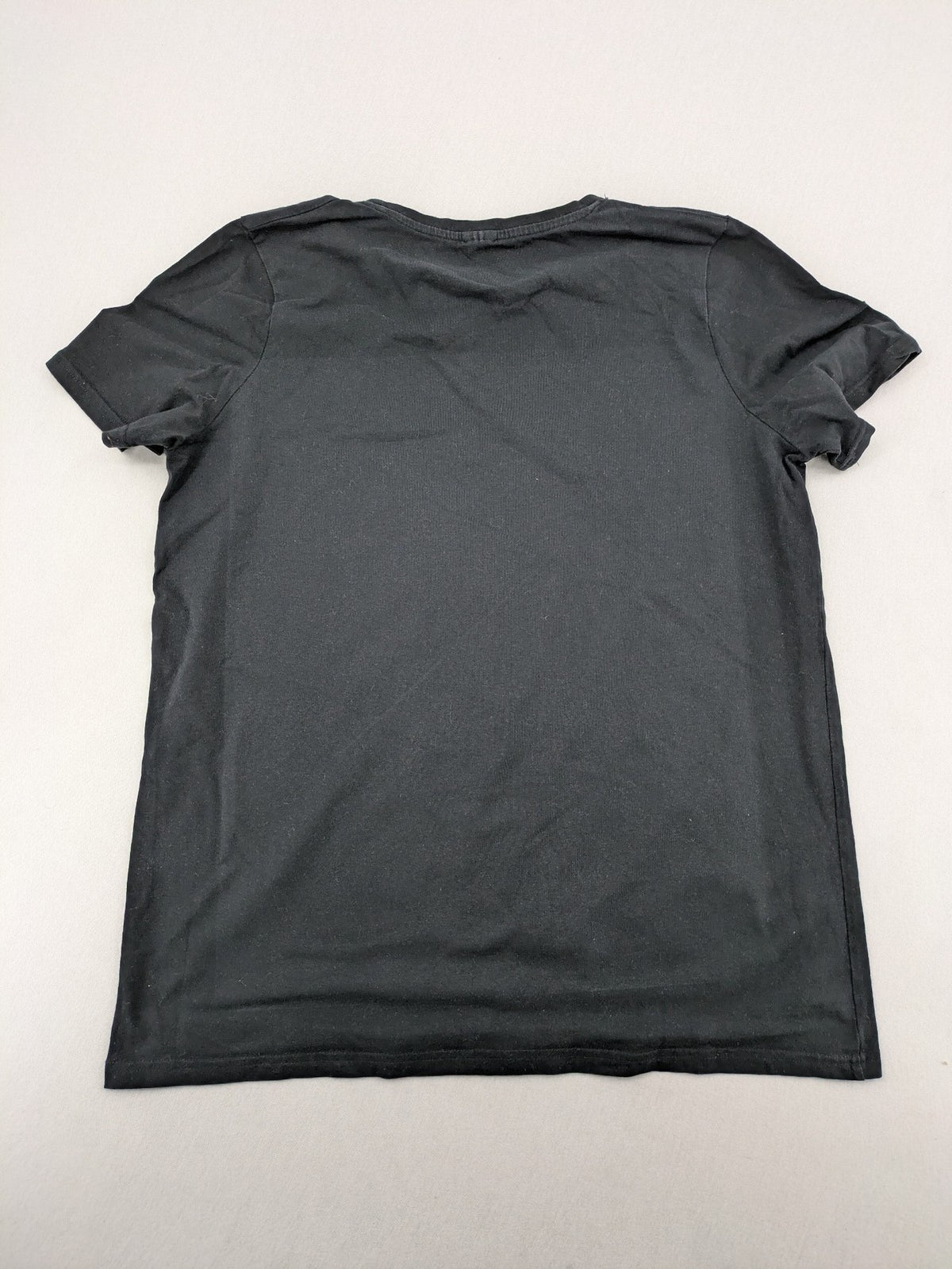 Dragon Ball Z black t-shirt featuring blue Son Goku silhouette graphic design.