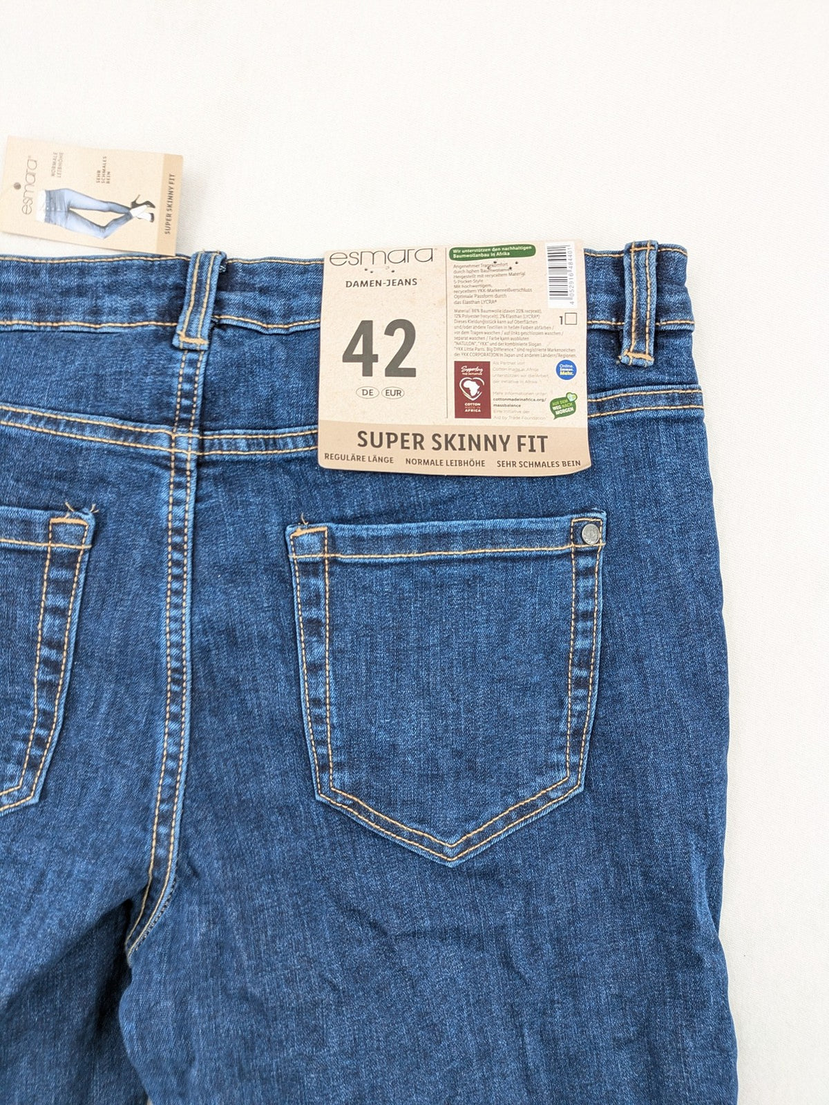 ESMARA blue super skinny jeans with dark wash and stretch denim material.