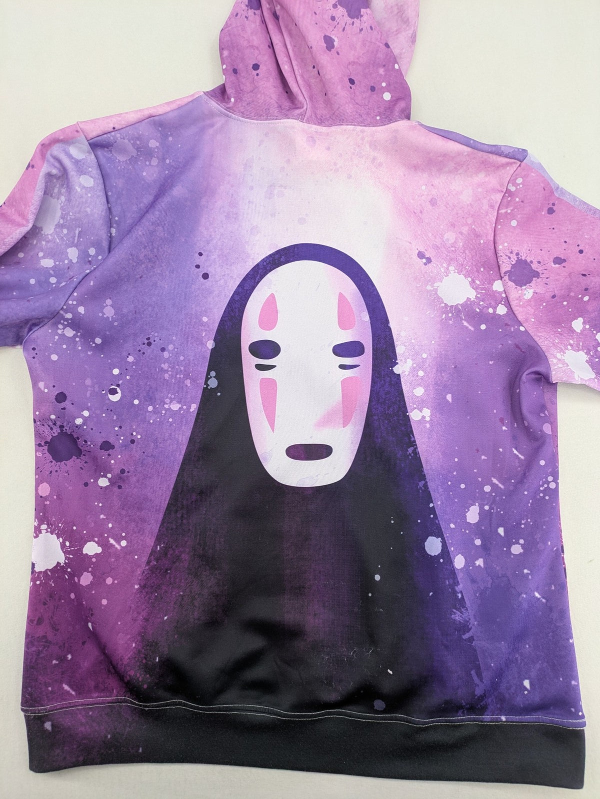 Lila zip-through hoodie multi-coloured featuring No Face graphic, front kangaroo pocket, drawstring hood.