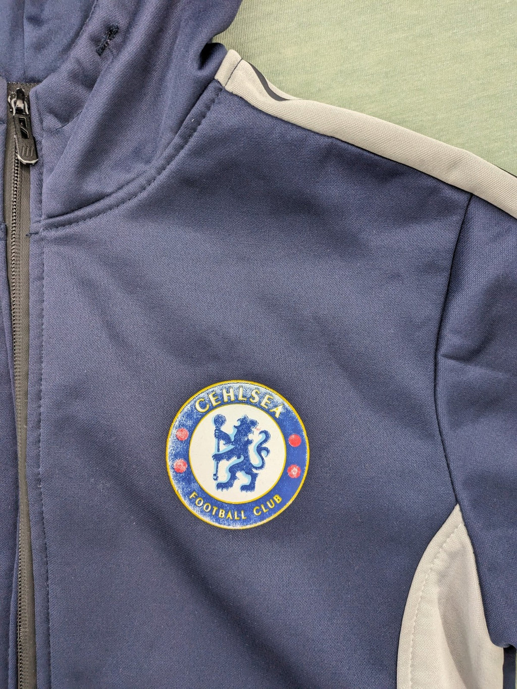 Chelsea FC grey and navy tracksuit set with full zip hoodie and three logos.