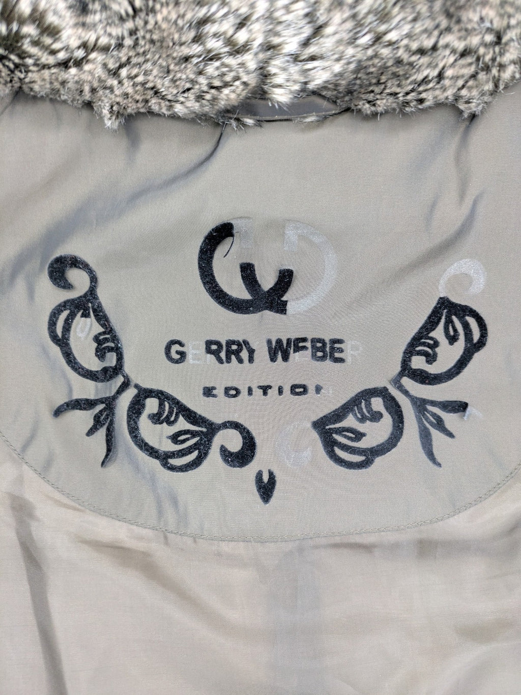 Gerry Weber Edition grey quilted coat with faux fur collar and metal toggle closures.
