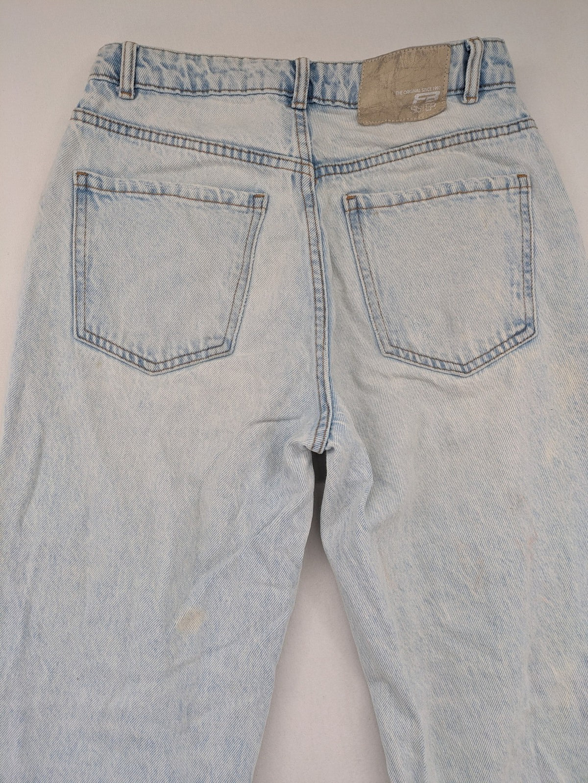 FB Sister blue mom jeans high waist distressed denim with knee rips and classic fit.