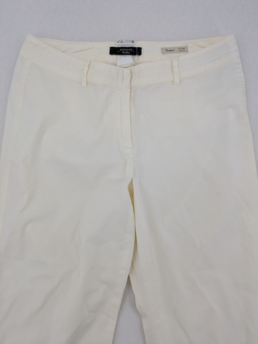 MaxMara cream cropped chino pants with zipper closure, belt loops, and back pockets.