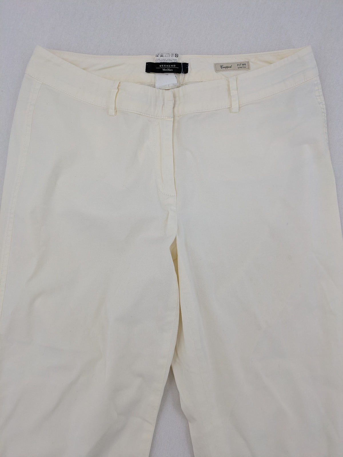 MaxMara cream cropped chino pants with zipper closure, belt loops, and back pockets.