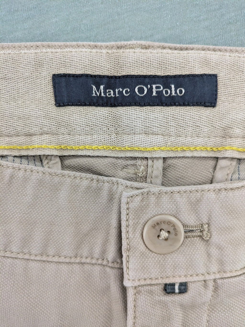 Marc O'Polo beige tapered fit chino pants, soft cotton stretch fabric, modern silhouette.