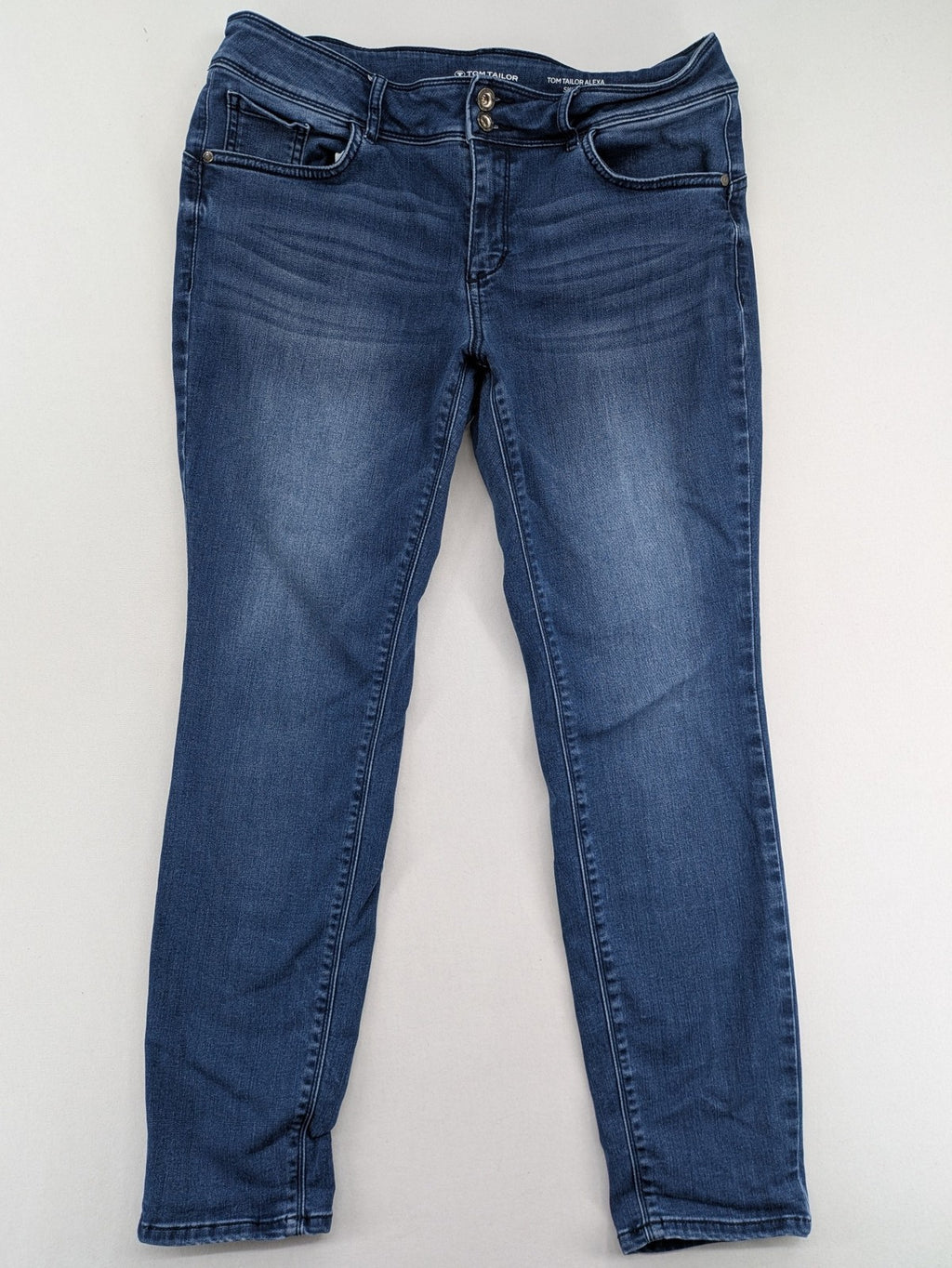Tom Tailor blue skinny jeans with classic 5-pocket design and double button closure.