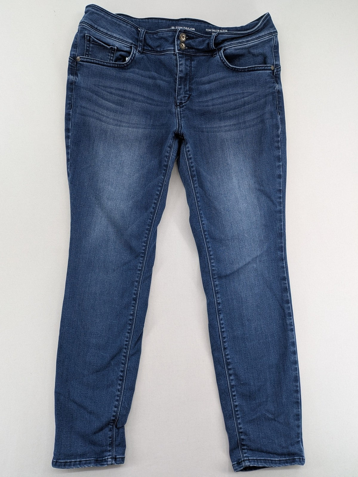 Tom Tailor blue skinny jeans with classic 5-pocket design and double button closure.