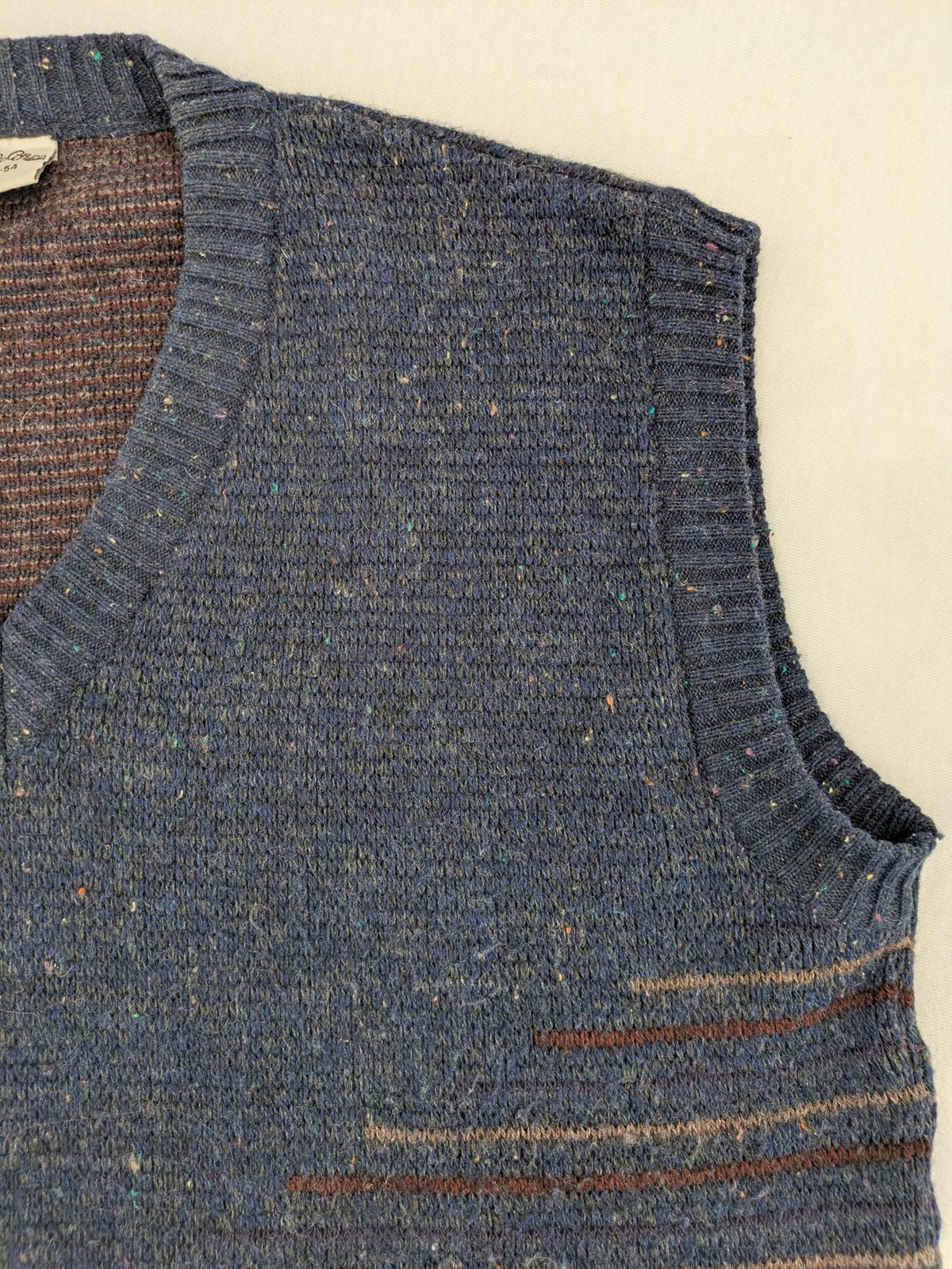 Angelo Litrico blue vest with V-neck, striped pattern, and textured melange design.