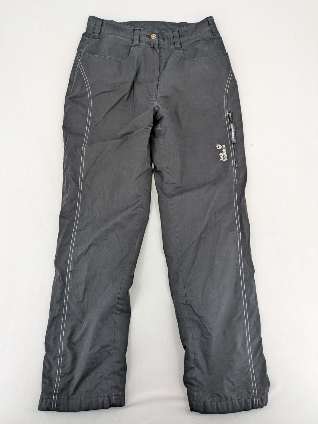 Jack Wolfskin grey outdoor pants with embroidered logo and side zip pocket.