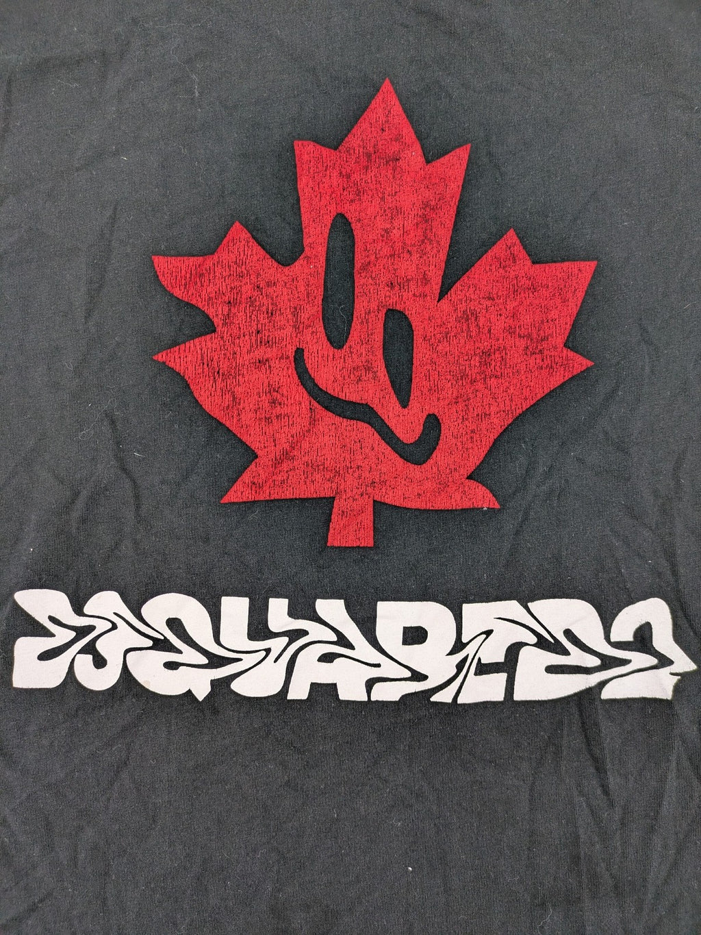 Dsquared2 grey short sleeve shirt with red maple leaf and smiley face graphic.