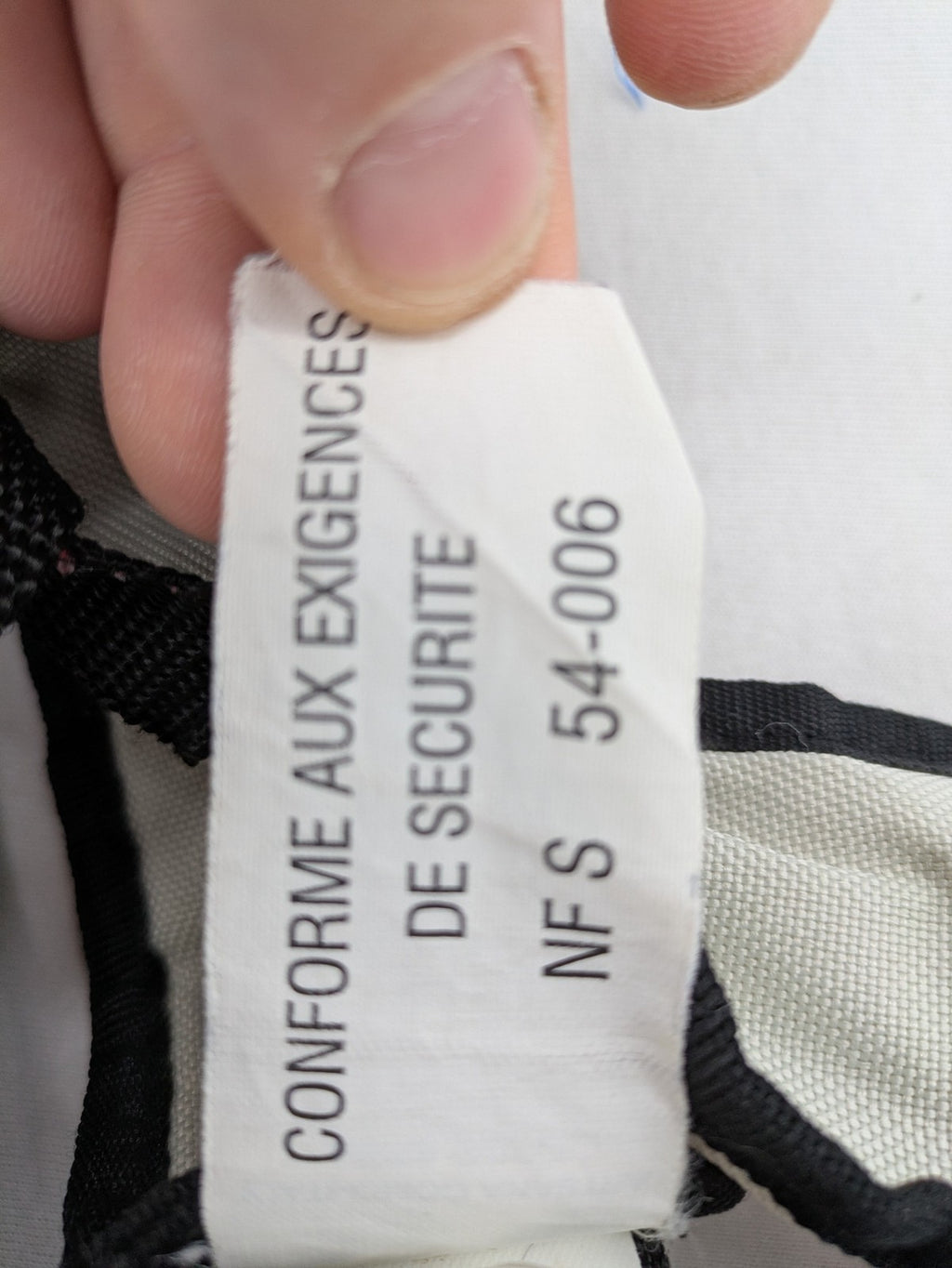 Chicco beige and black baby carrier adjustable straps with padded support for comfort.