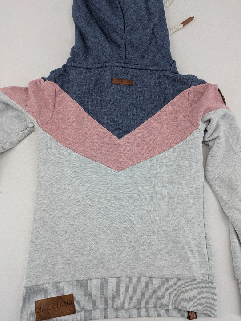 Naketano multi turtle neck jumper colorblock design in blue, pink, and grey.