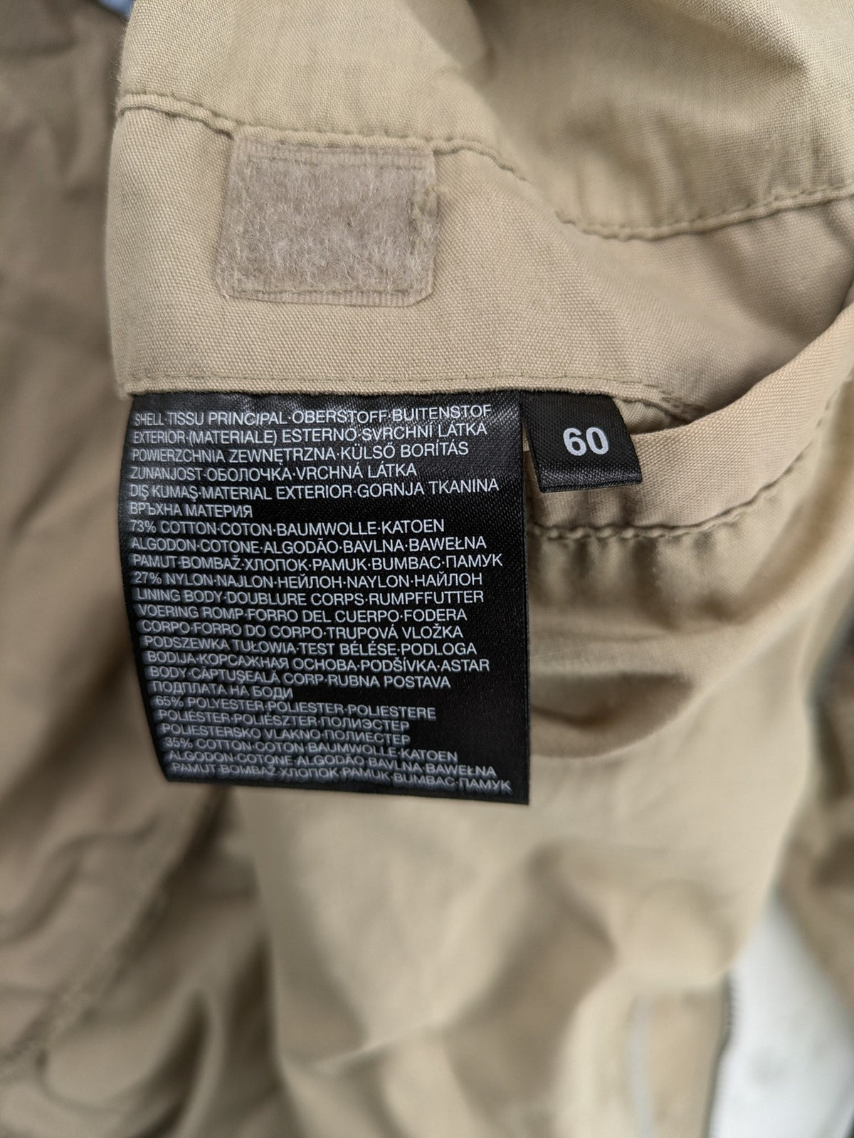 Canda beige bomber jacket full zip with ribbed collar and buttoned chest pockets.
