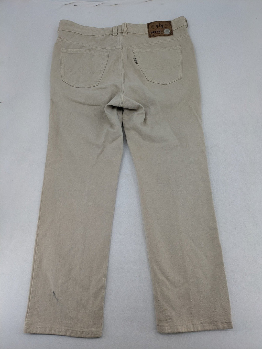 Joker beige straight jeans 5-pocket design with zipper and button closure.