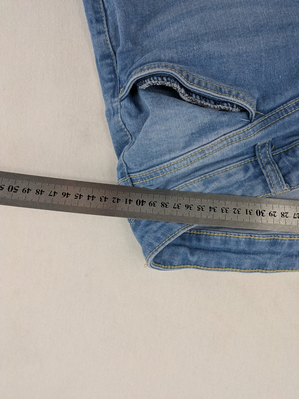Janina blue skinny fit jeggings with elastic waistband and angled front pockets.