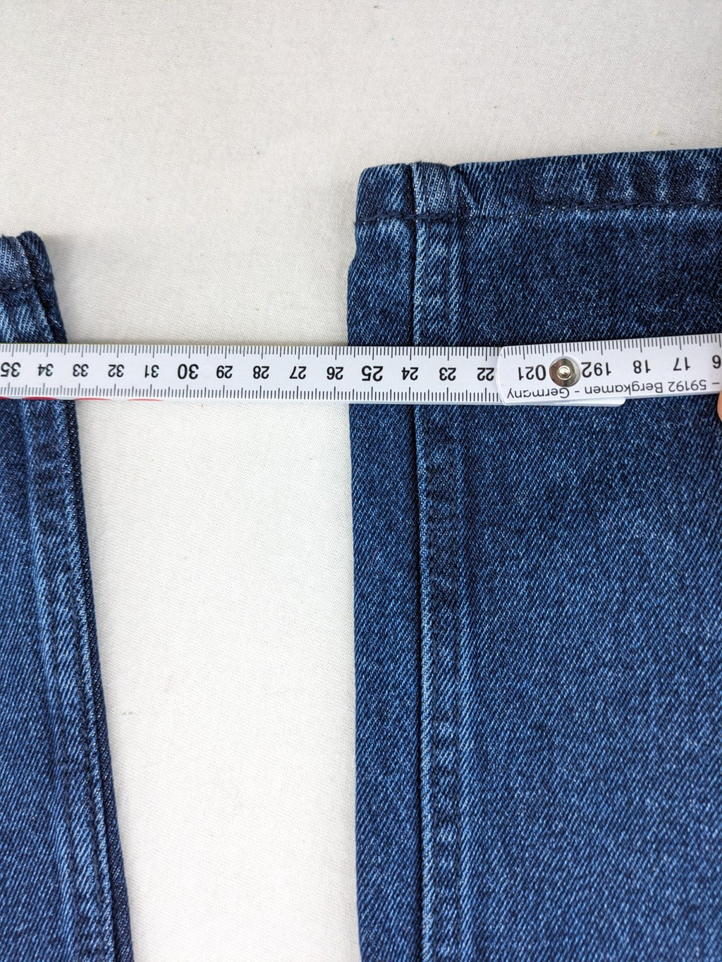 Tchibo blue straight jeans with five-pocket design and wide leg cut in durable cotton.