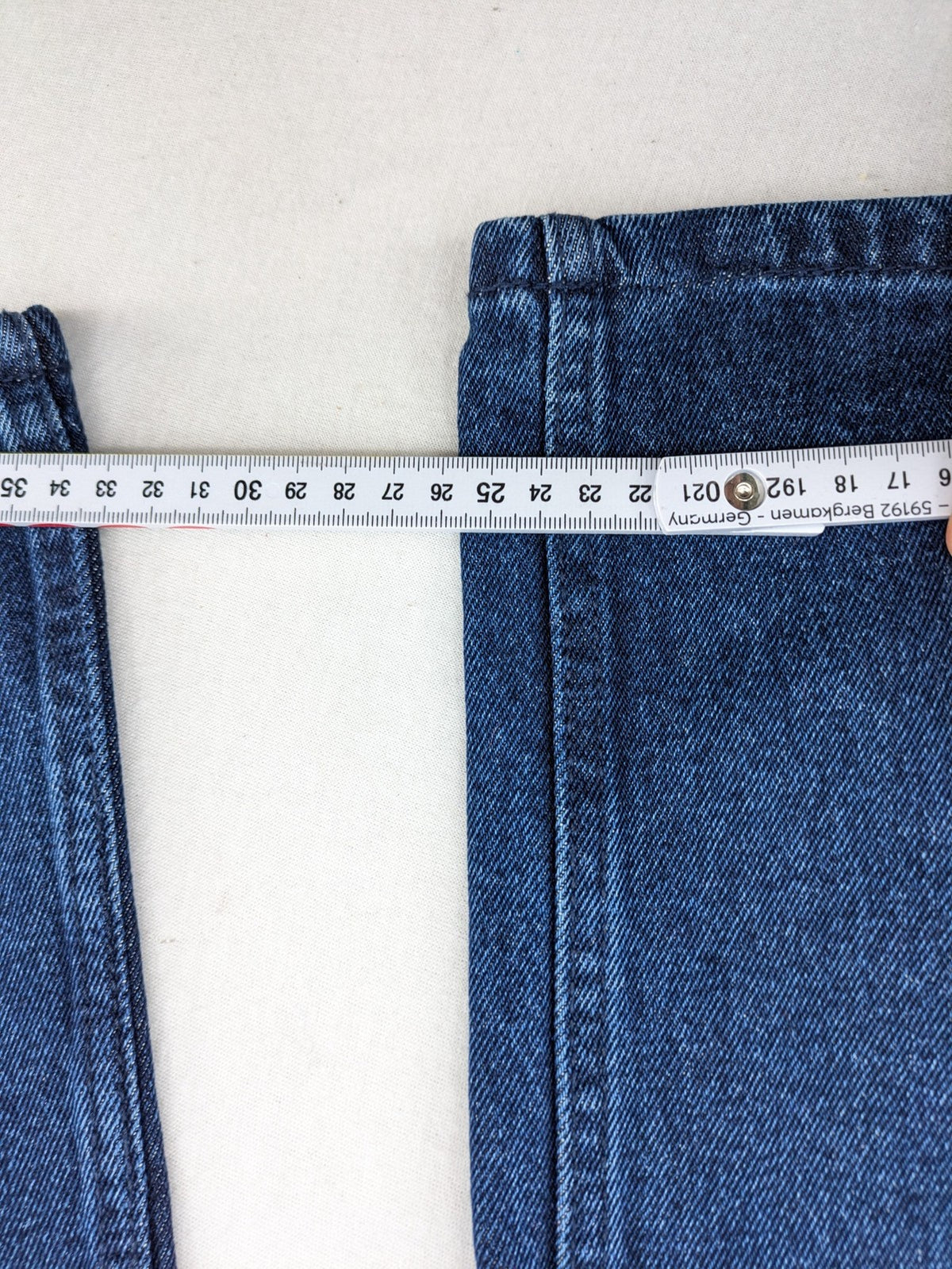 Tchibo blue straight jeans with five-pocket design and wide leg cut in durable cotton.
