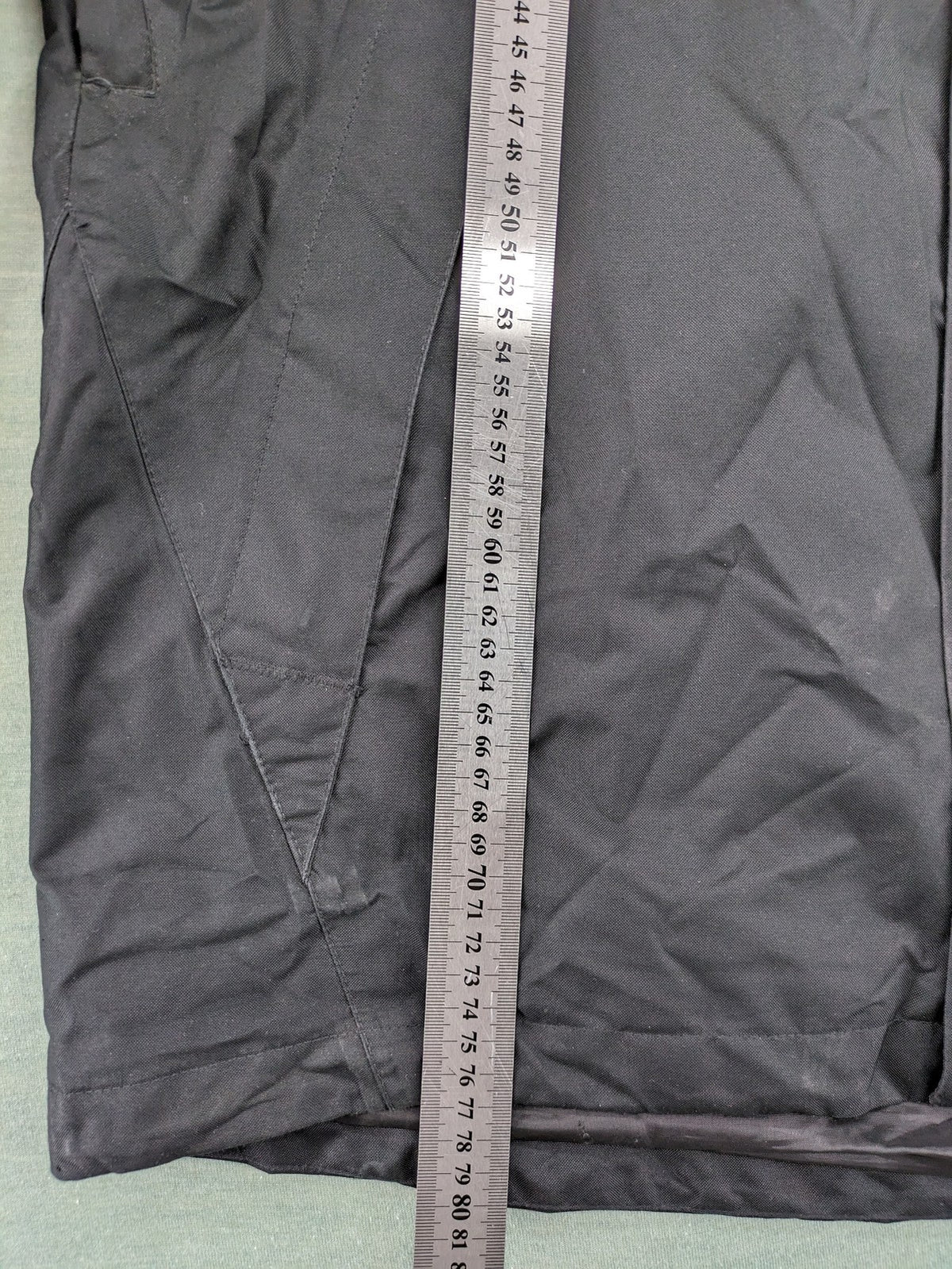 Stormtech black waterproof jacket with ZF logo, H2Xtreme technology, front zipper, and hood.