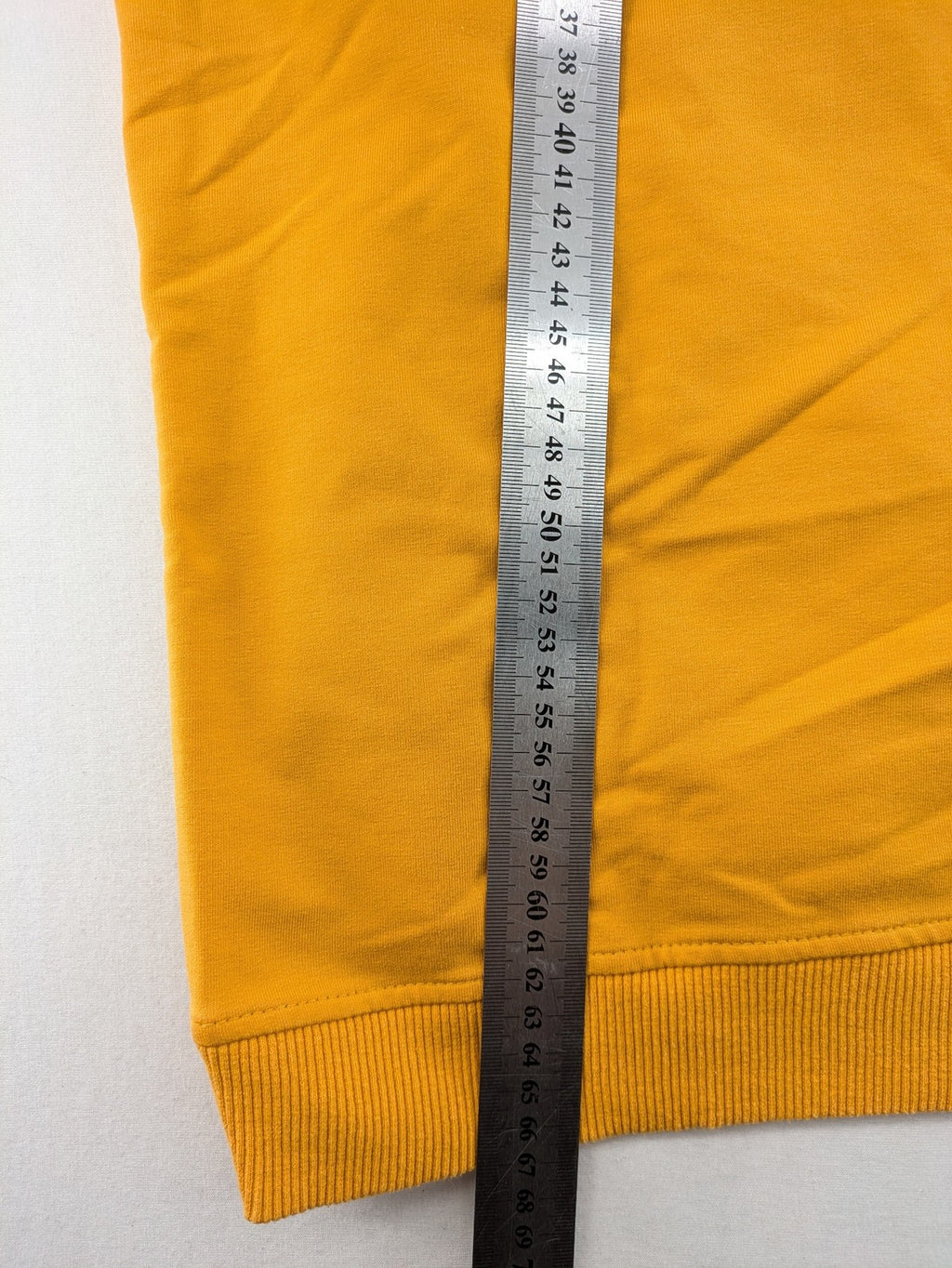 Columbia yellow turtle neck jumper with iconic logo, ribbed cuffs, and soft cotton material.