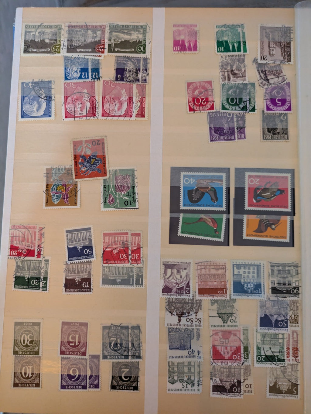 Beige postage stamp album featuring over 1000 stamps from Germany and Europe.