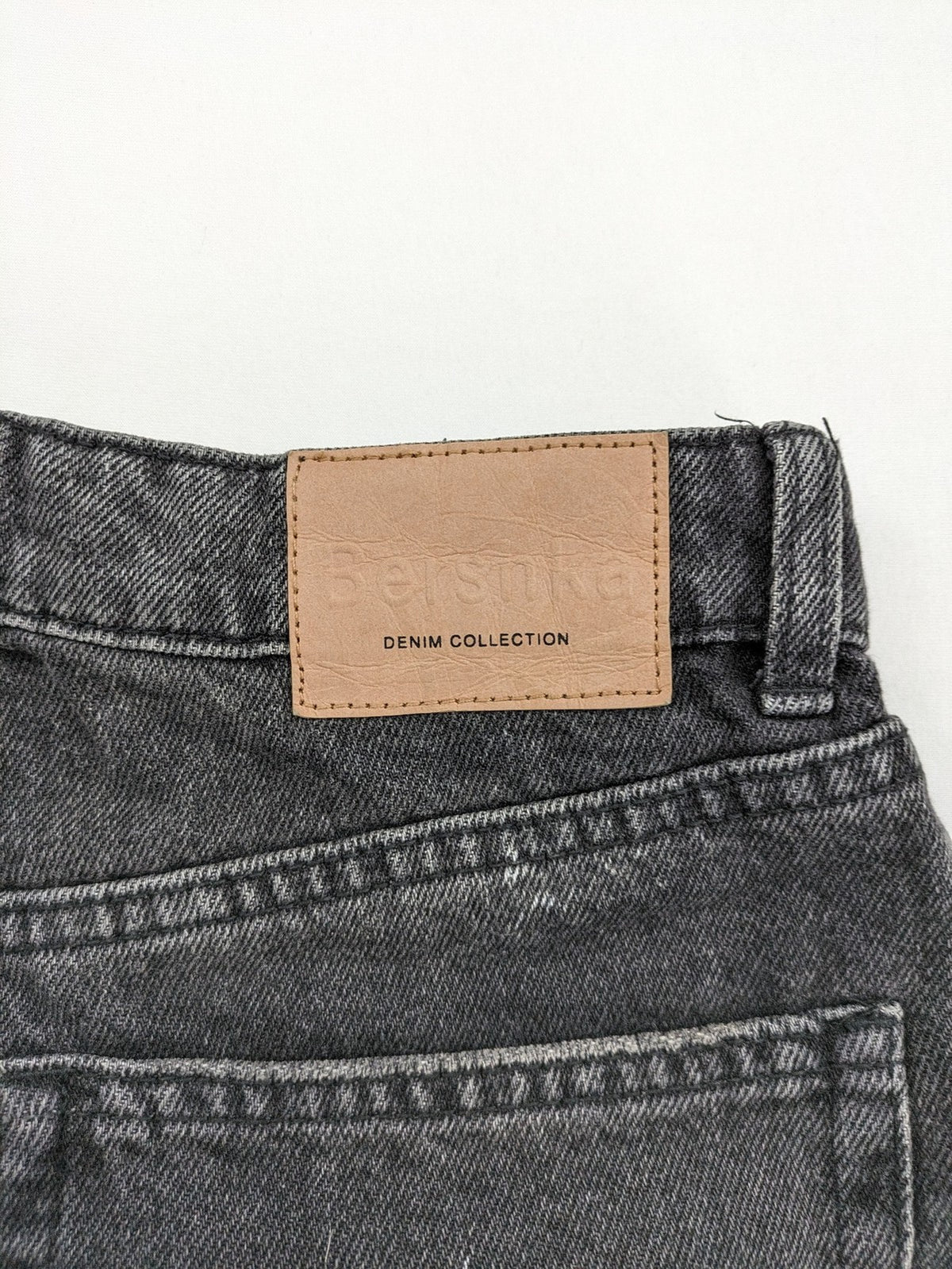 Bershka black mom jeans high-waist straight leg washed denim with classic five-pocket design.