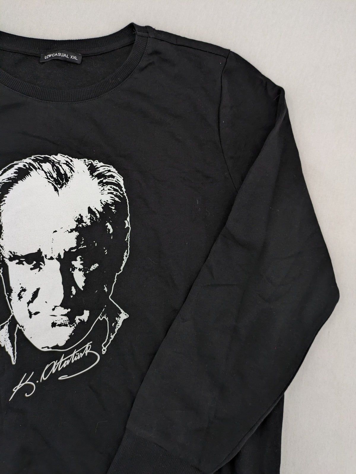 LC Waikiki black turtle neck jumper featuring Atatürk graphic print and signature.