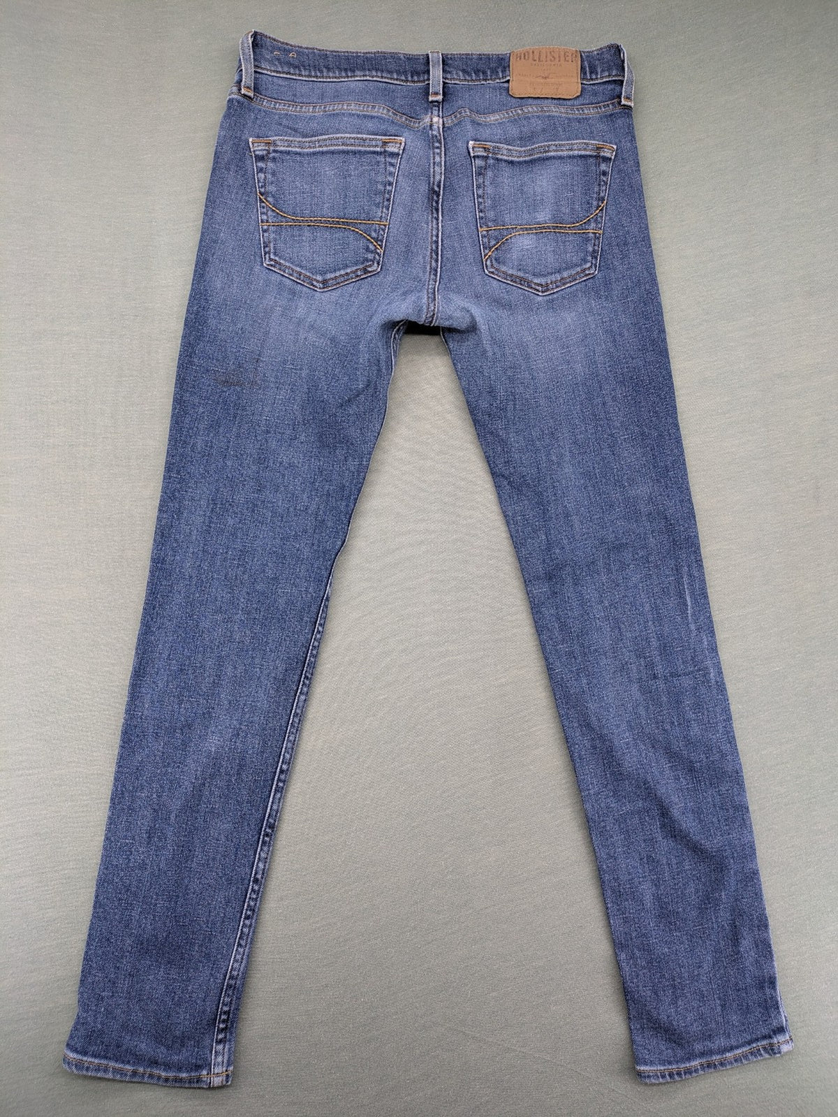 Hollister blue slim fit jeans with classic 5-pocket design and stretch denim material.