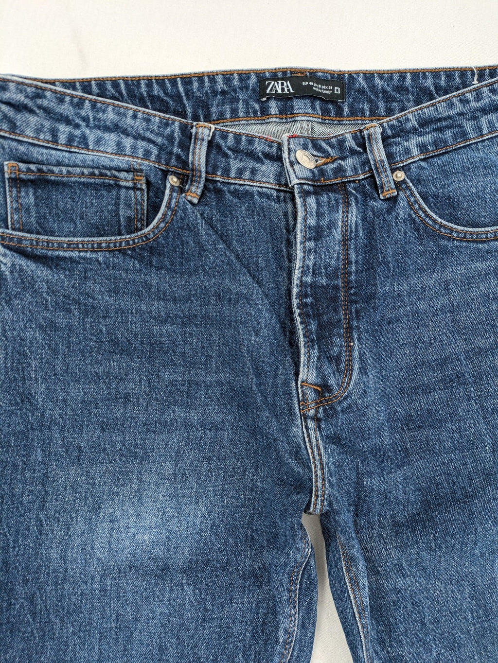 Zara blue straight jeans with classic 5-pocket design and button fly.