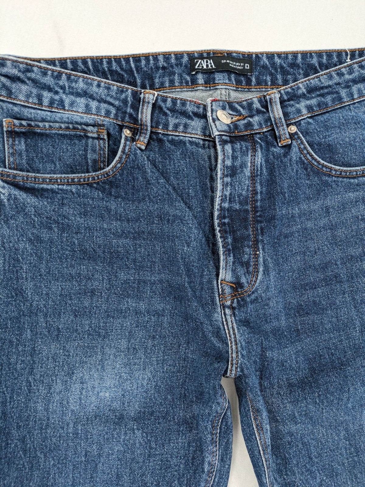 Zara blue straight jeans with classic 5-pocket design and button fly.