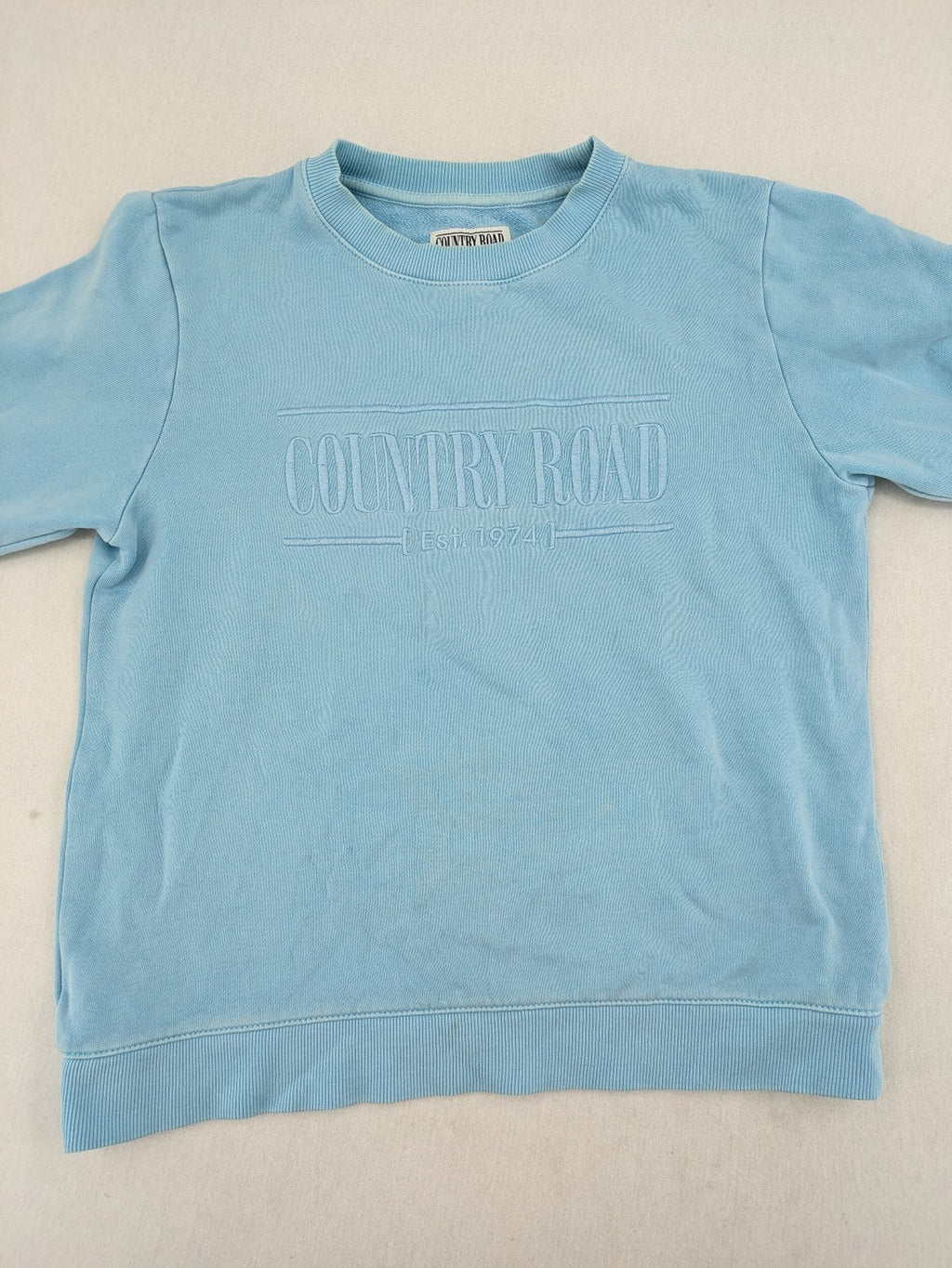Country Road blue turtle neck jumper with embossed logo on chest, made from cotton.
