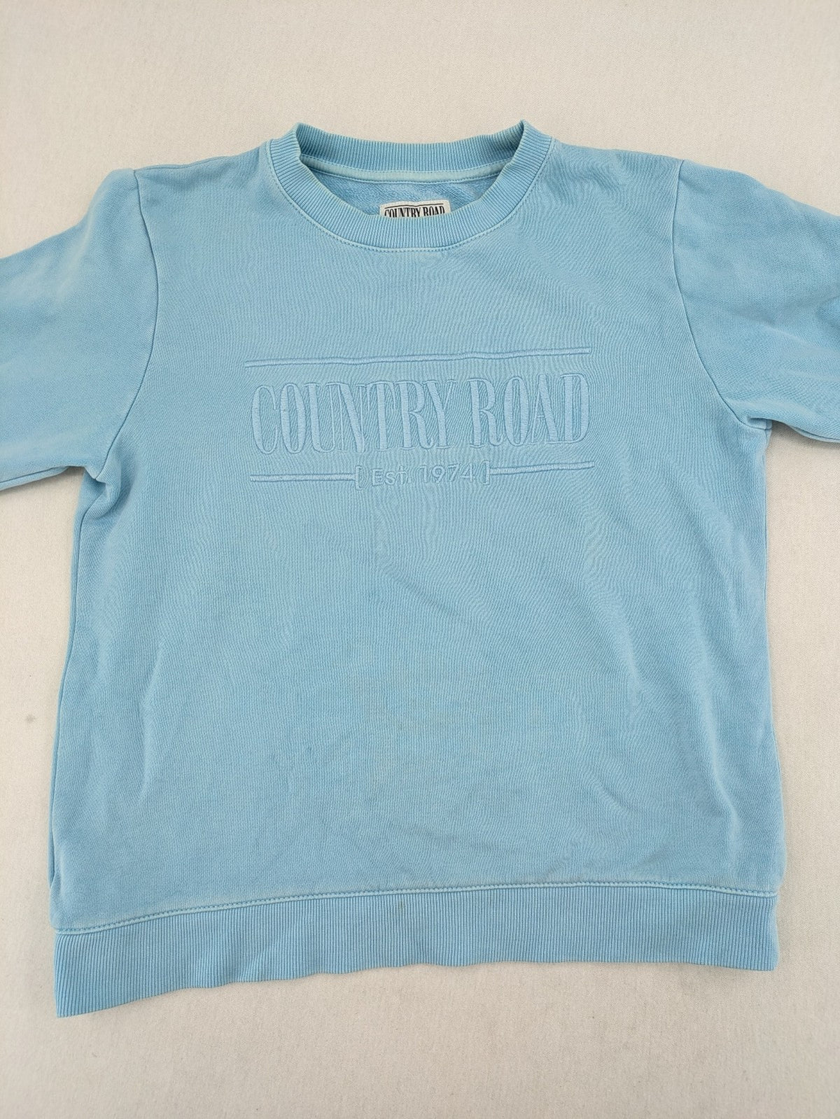 Country Road blue turtle neck jumper with embossed logo on chest, made from cotton.