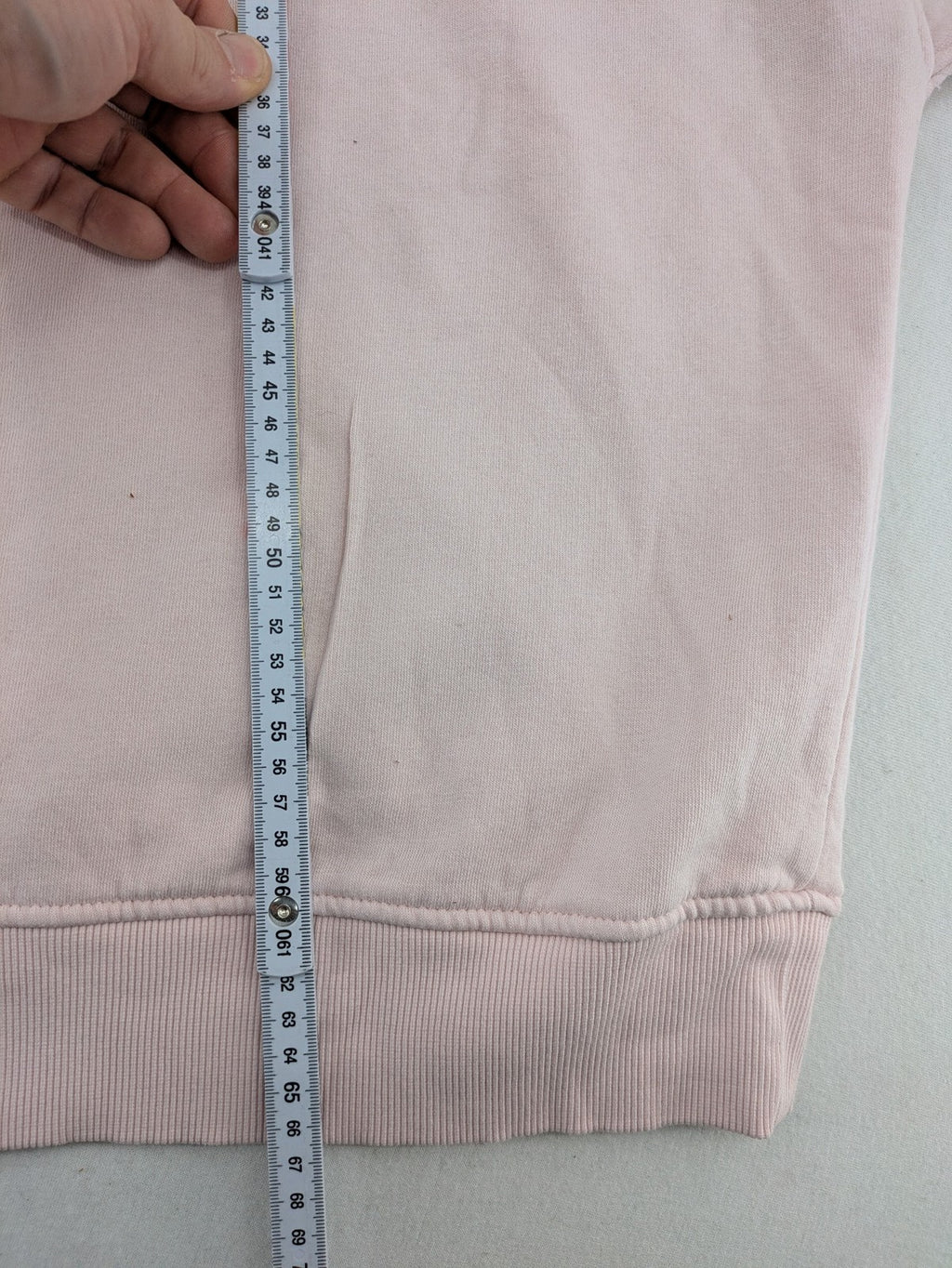 Hello Kitty pink sweatshirt classic graphic face logo on chest, long sleeves, round neck.