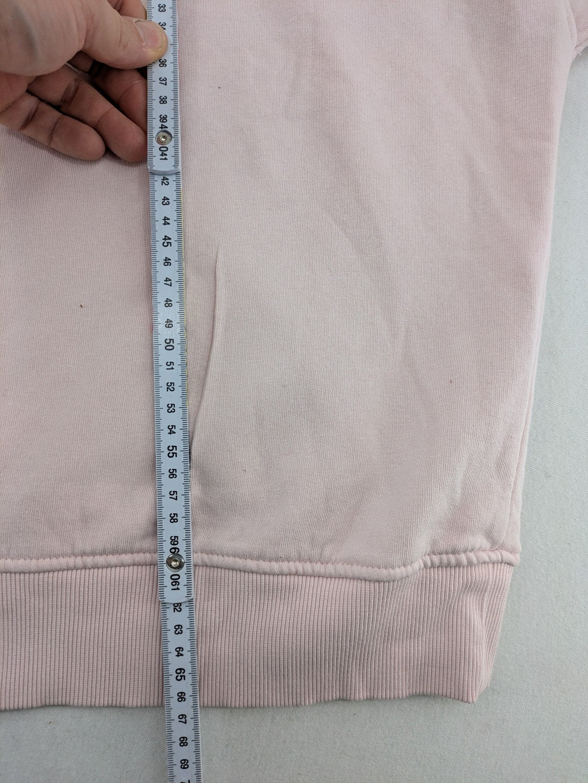 Hello Kitty pink sweatshirt classic graphic face logo on chest, long sleeves, round neck.