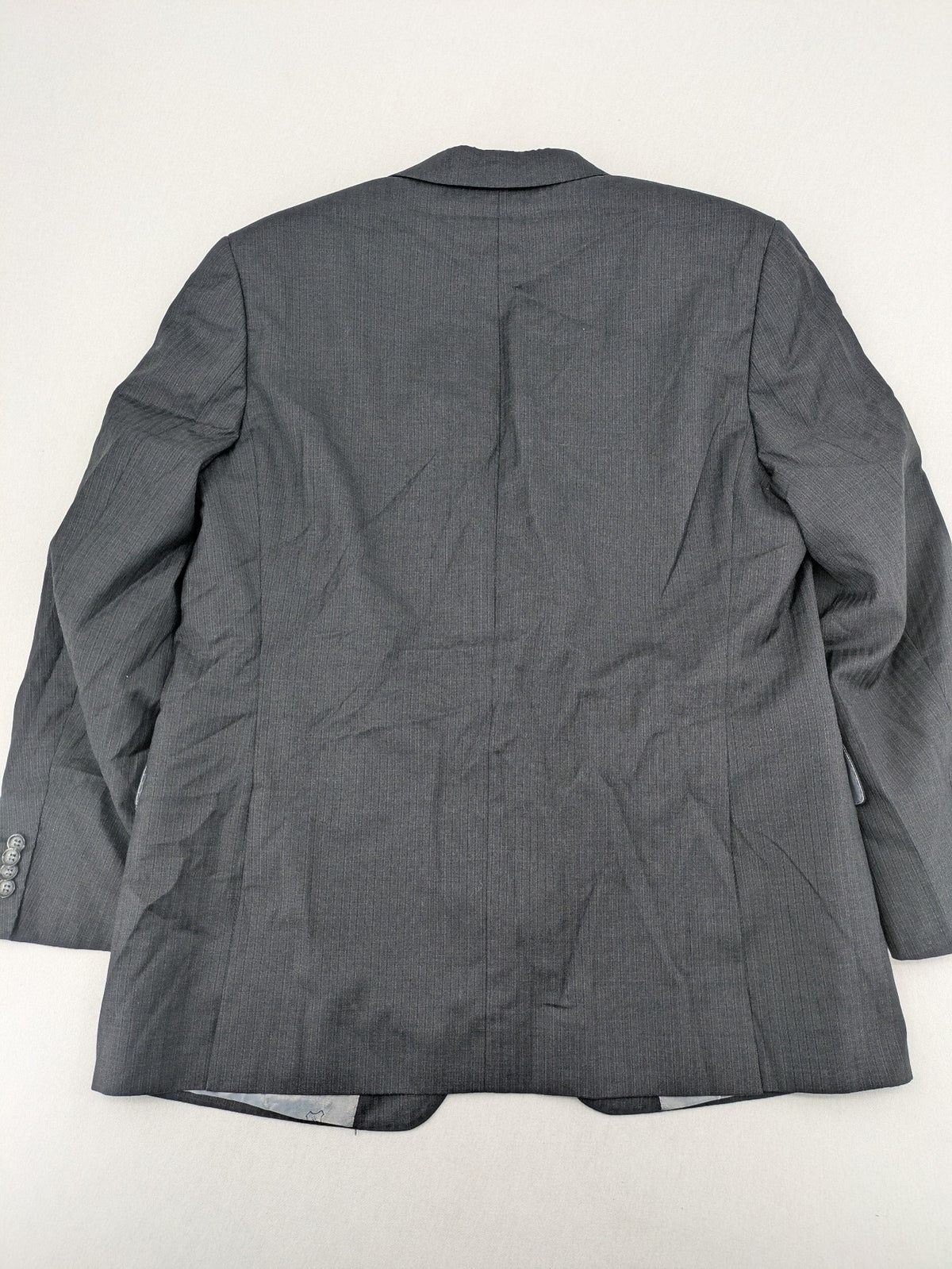 Desch grey blazer with dark grey pinstripe pattern, satin lining, and tailored design.