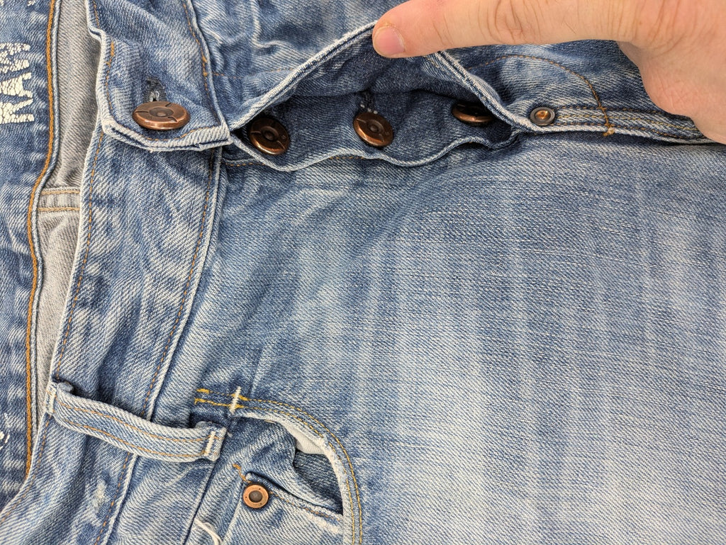 G-Star Raw blue straight jeans with distressed details and classic button fly.